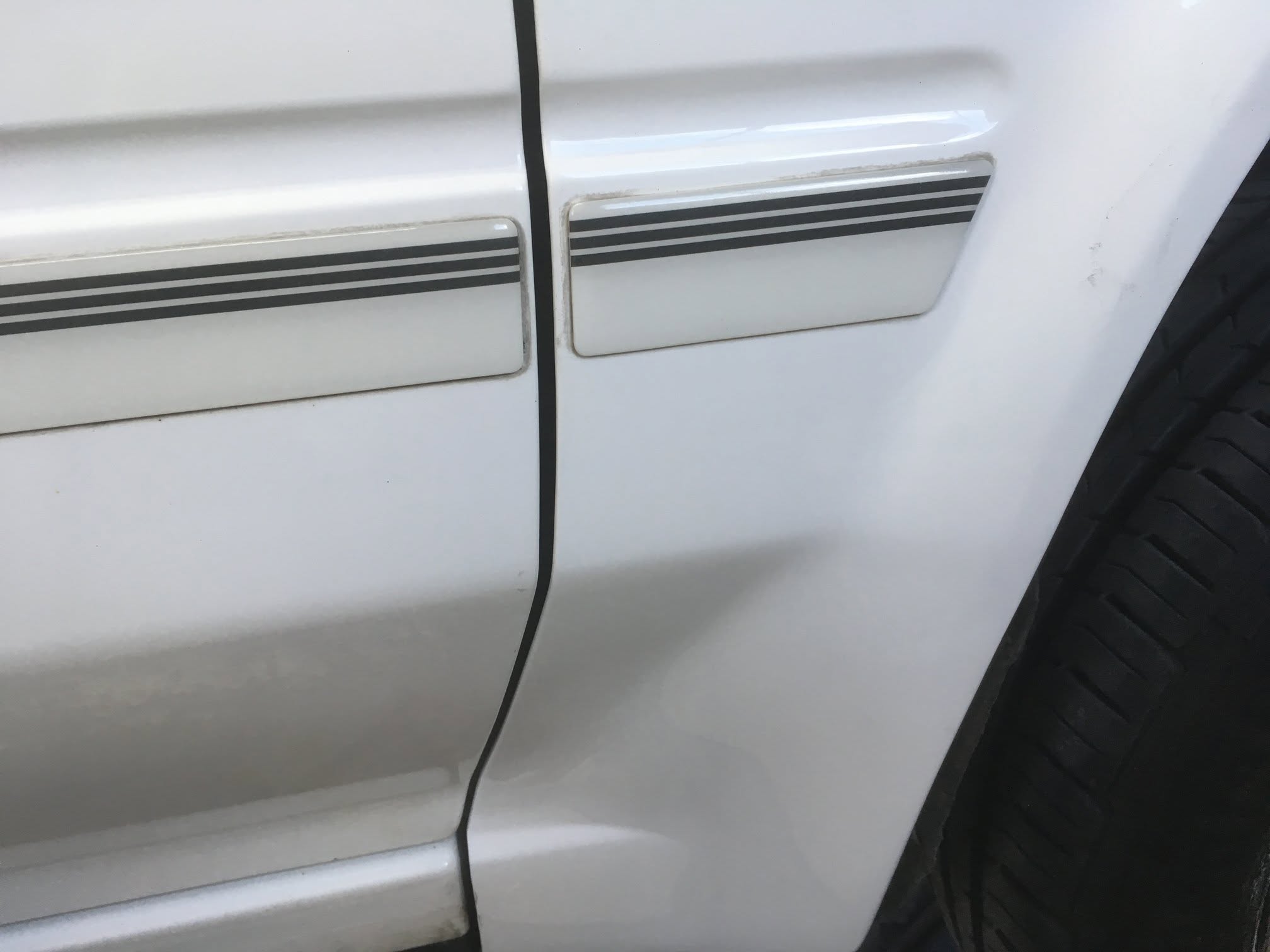 Toyota MR2 wing and door-hinge panel after rust repair